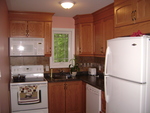 Studio Apt.  Kitchen<br><br>The kitchen is fully equipped with all new appliances.  The kitchen contains a stove, microwave oven, dish washer, fridge, and dishes.  The kitchen is modern and it has ceramic floors and back splash.  <br>